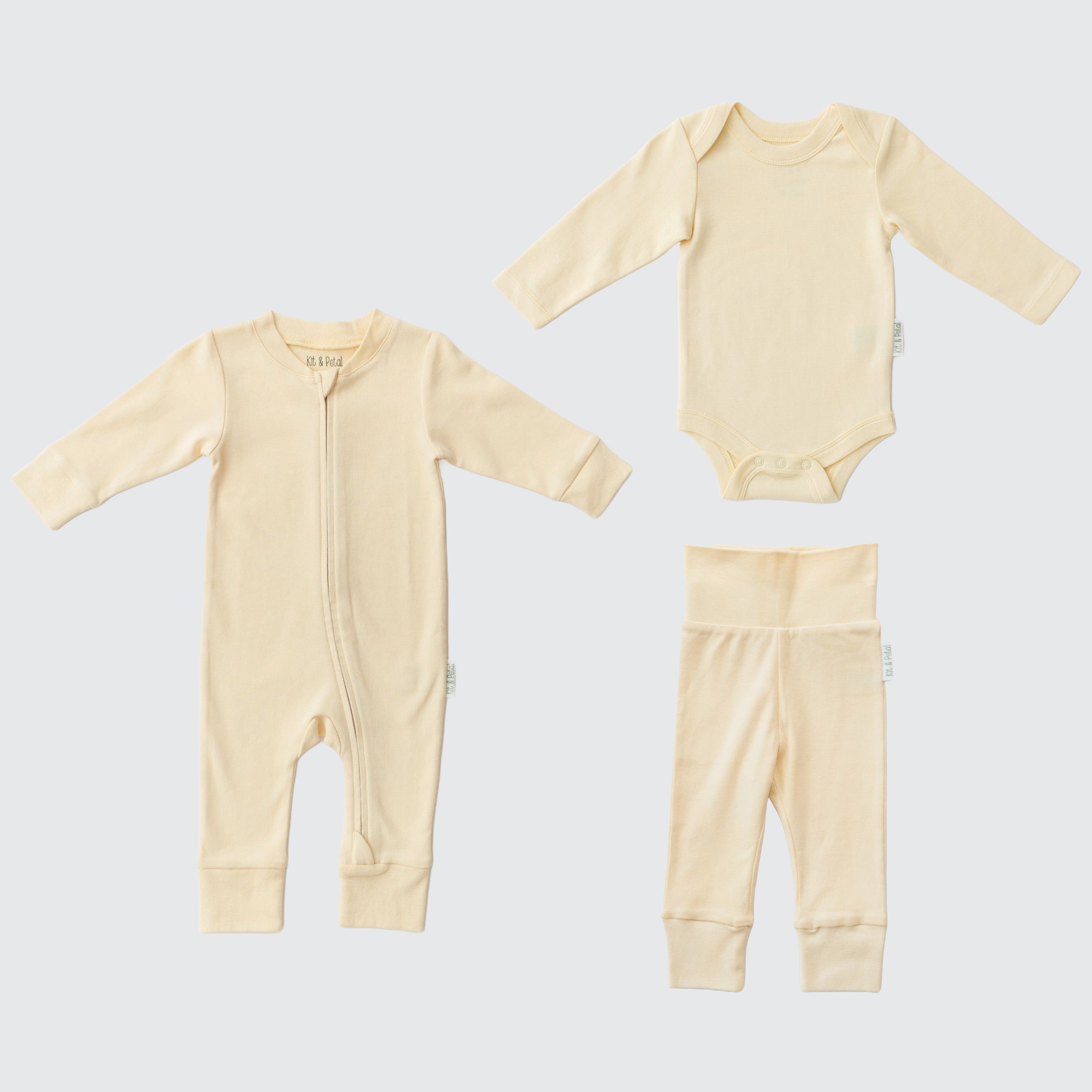 Sunny yellow organic cotton baby outfit set with long sleeve romper, long sleeve bodysuit, and fold-over pants.