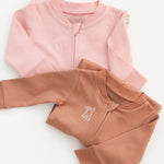 Long sleeve rompers in pink and brown with bunny embroidery on the chest