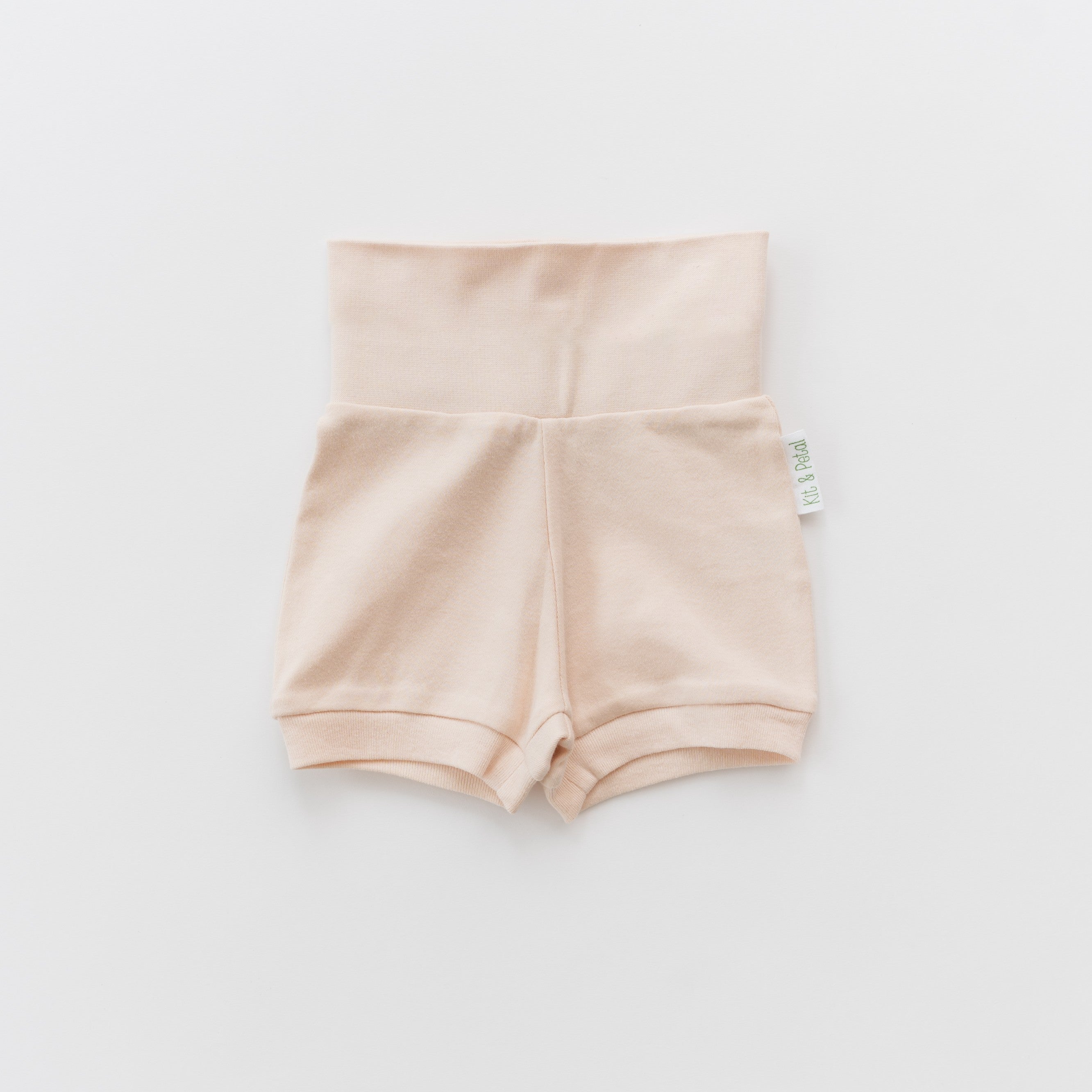 Organic cotton baby fold-over shorts in rosy peach