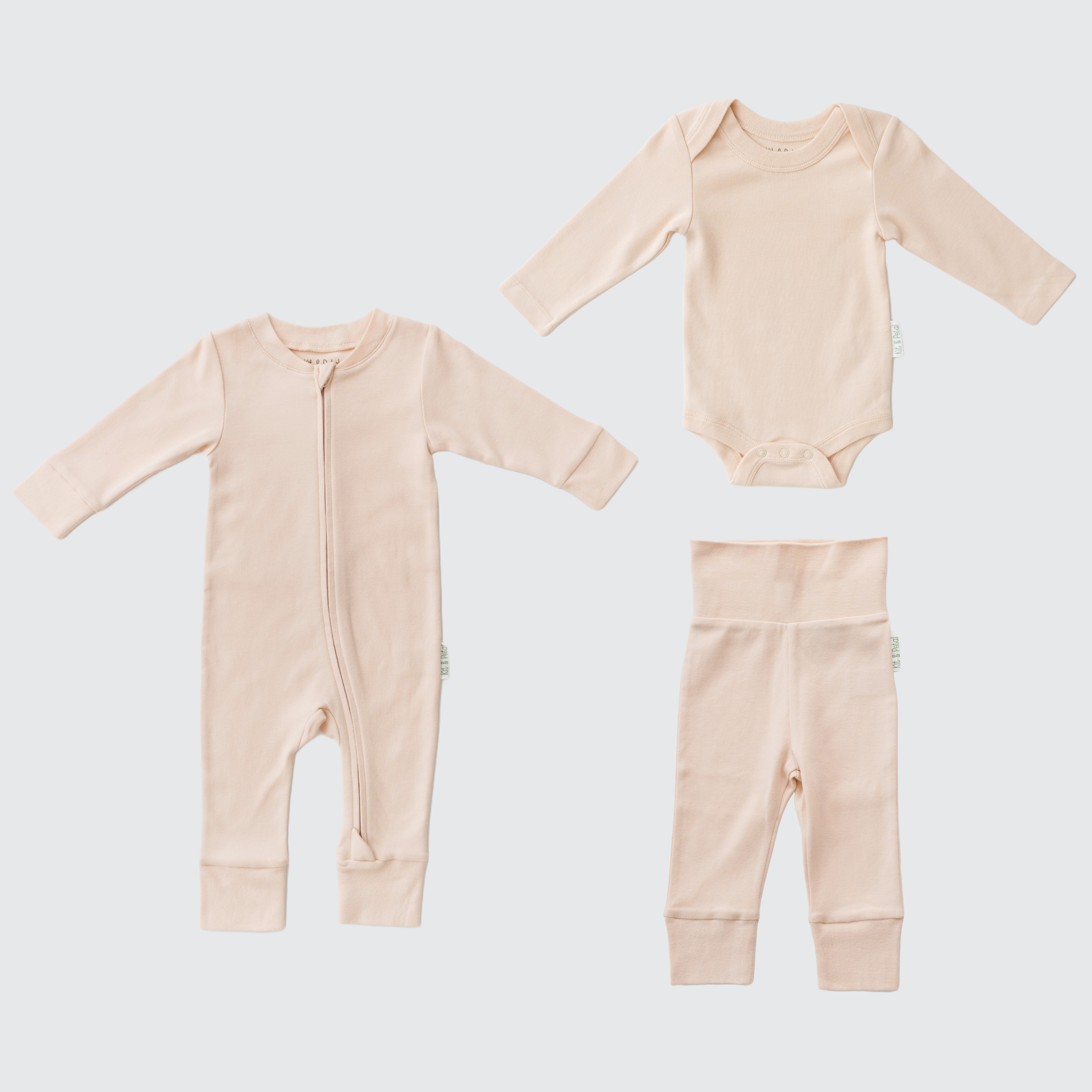 Gift set with Rosy Peach long sleeve romper, long sleeve bodysuit, and fold-over pants made from soft organic cotton.