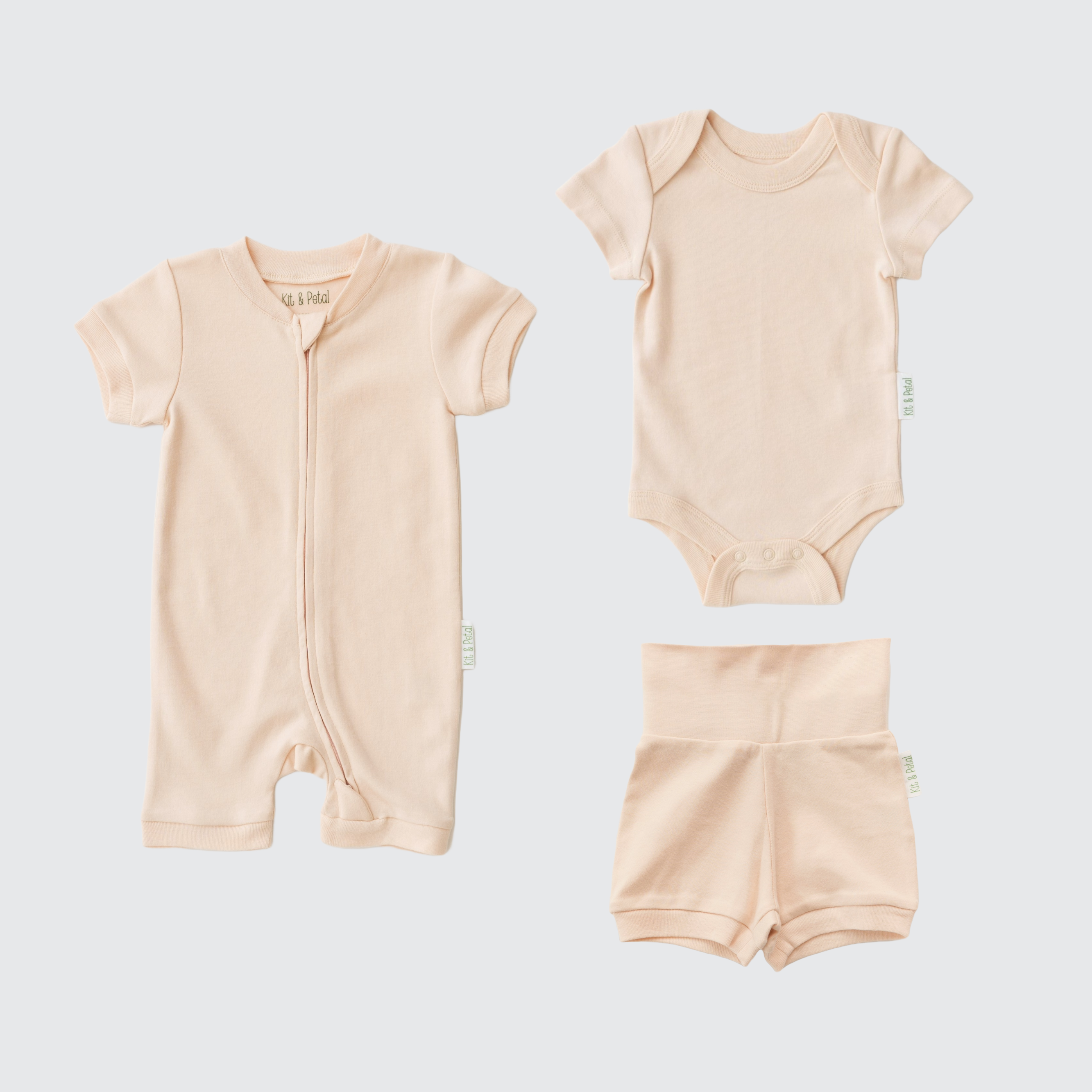Rosy Peach organic cotton baby outfit set with short sleeve romper, short sleeve bodysuit, and fold-over shorts.