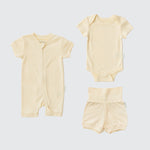 Sunny yellow organic cotton baby outfit set with short sleeve romper, short sleeve bodysuit, and fold-over shorts.