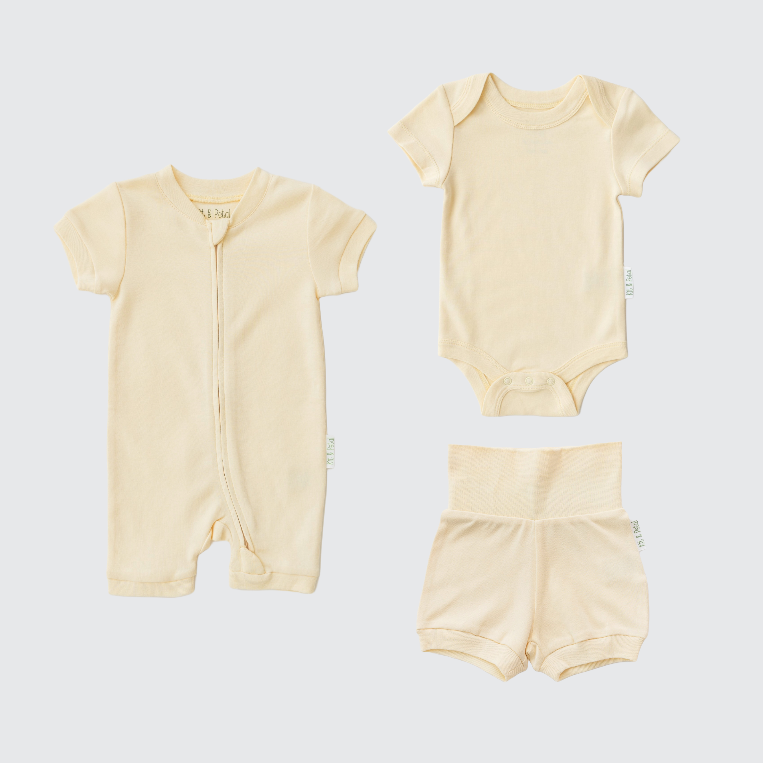 Sunny Yellow organic cotton baby outfit set with short sleeve romper, short sleeve bodysuit, and fold-over shorts.